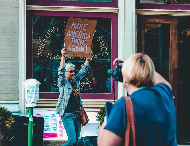 woman holding protest sign