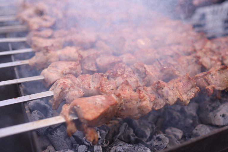 close up of kebabs on the grill