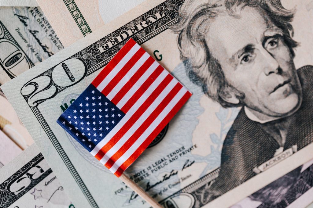 set of usa dollars and national flag